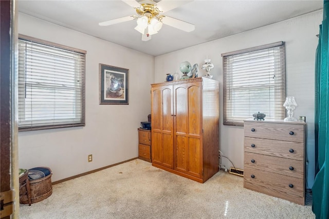 918 29th St NW, Cedar Rapids, IA 52405 - bedroom featuring multiple windows, light carpet, and ceiling fan