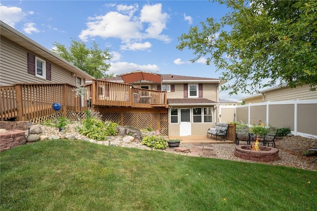 918 29th St NW, Cedar Rapids, IA 52405 - back of property with an outdoor fire pit and a wooden deck