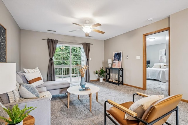 780 Magnolia Ln Unit 4, Marion, IA 52302 - carpeted living area with ceiling fan and baseboards