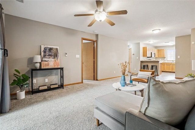780 Magnolia Ln Unit 4, Marion, IA 52302 - living room featuring ceiling fan and light colored carpet