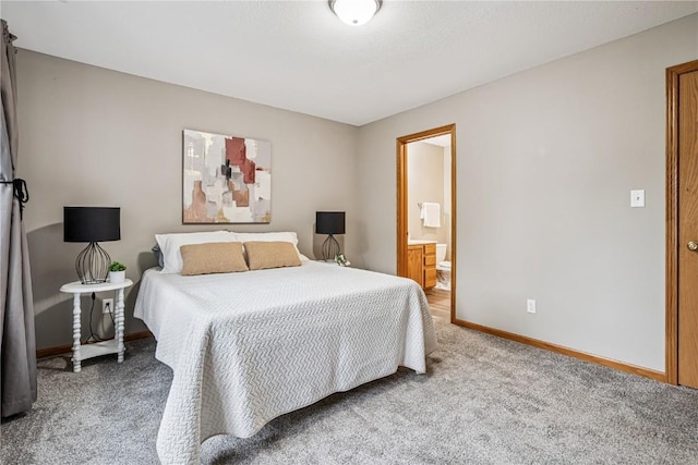 780 Magnolia Ln Unit 4, Marion, IA 52302 - carpeted bedroom with baseboards and ensuite bathroom