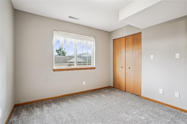 780 Magnolia Ln Unit 4, Marion, IA 52302 - unfurnished bedroom featuring carpet floors and a closet
