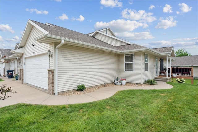 2176 49th St, Marion, IA 52302 - view of home's exterior featuring a garage, roof with shingles, a yard, and driveway
