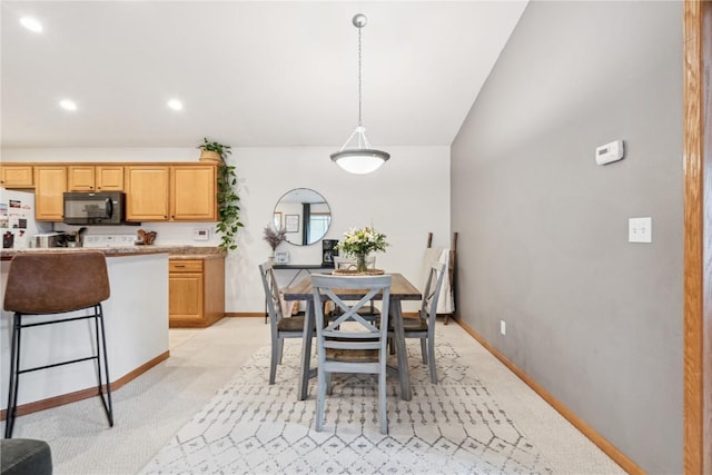 2176 49th St, Marion, IA 52302 - dining room featuring light carpet, recessed lighting, and lofted ceiling