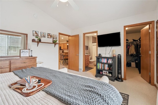 2176 49th St, Marion, IA 52302 - bedroom featuring a walk in closet, lofted ceiling, carpet flooring, connected bathroom, and ceiling fan