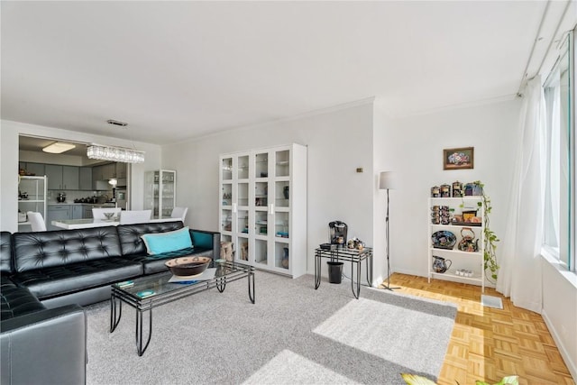 2222 1st Ave, Cedar Rapids, IA 52402 - living area with plenty of natural light and crown molding