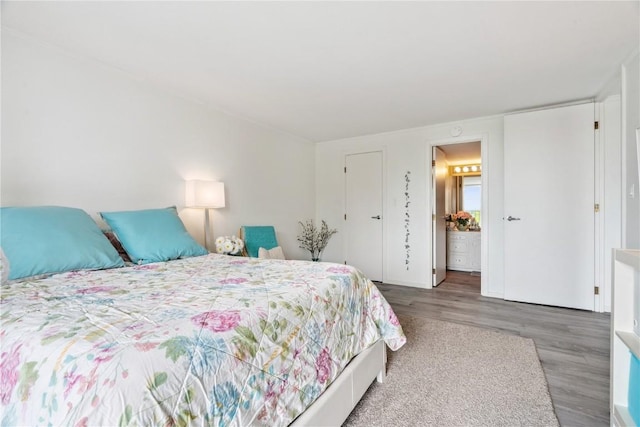 2222 1st Ave, Cedar Rapids, IA 52402 - bedroom featuring wood finished floors and connected bathroom