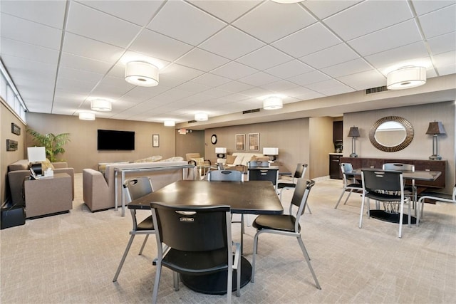 2222 1st Ave, Cedar Rapids, IA 52402 - dining room featuring light colored carpet and a paneled ceiling