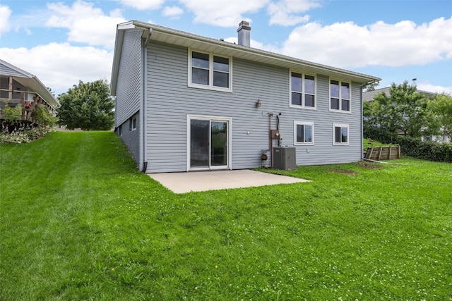 4812 Montclair Dr NW, Cedar Rapids, IA 52405 - back of house featuring a patio, a yard, and a chimney