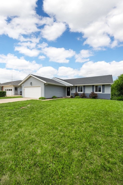4812 Montclair Dr NW, Cedar Rapids, IA 52405 - ranch-style house with an attached garage, concrete driveway, and a front yard
