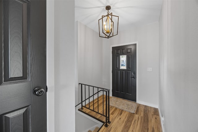4812 Montclair Dr NW, Cedar Rapids, IA 52405 - entrance foyer with wood finished floors and a chandelier