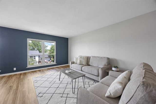 4812 Montclair Dr NW, Cedar Rapids, IA 52405 - living area featuring wood finished floors and baseboards