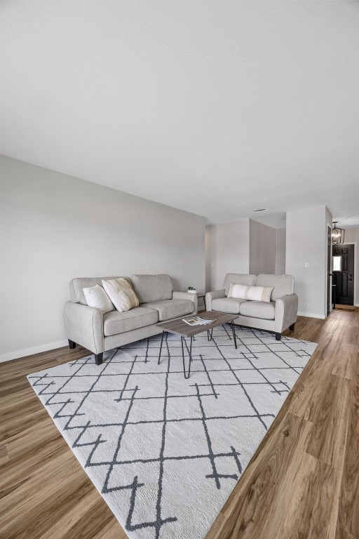 4812 Montclair Dr NW, Cedar Rapids, IA 52405 - living area featuring wood finished floors and baseboards