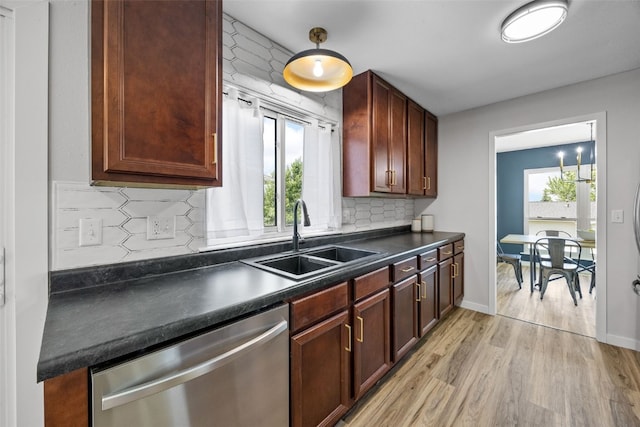 4812 Montclair Dr NW, Cedar Rapids, IA 52405 - kitchen featuring stainless steel dishwasher, dark countertops, light wood-style floors, and backsplash