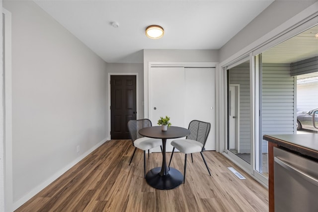 4812 Montclair Dr NW, Cedar Rapids, IA 52405 - dining area featuring light wood-style flooring and baseboards