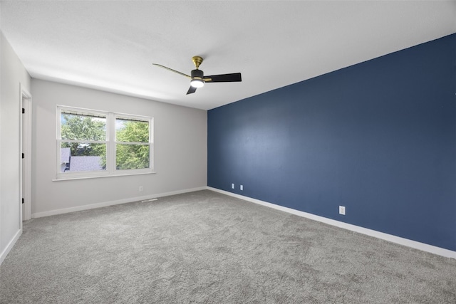 4812 Montclair Dr NW, Cedar Rapids, IA 52405 - carpeted empty room featuring ceiling fan and baseboards