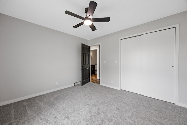 4812 Montclair Dr NW, Cedar Rapids, IA 52405 - unfurnished bedroom with carpet flooring, a closet, and a ceiling fan