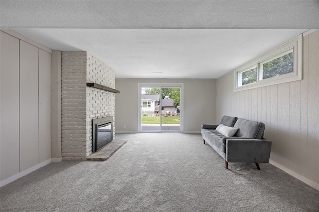 4812 Montclair Dr NW, Cedar Rapids, IA 52405 - carpeted living area with healthy amount of natural light, a brick fireplace, wood walls, and a textured ceiling