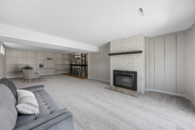 4812 Montclair Dr NW, Cedar Rapids, IA 52405 - living area with carpet flooring and a brick fireplace