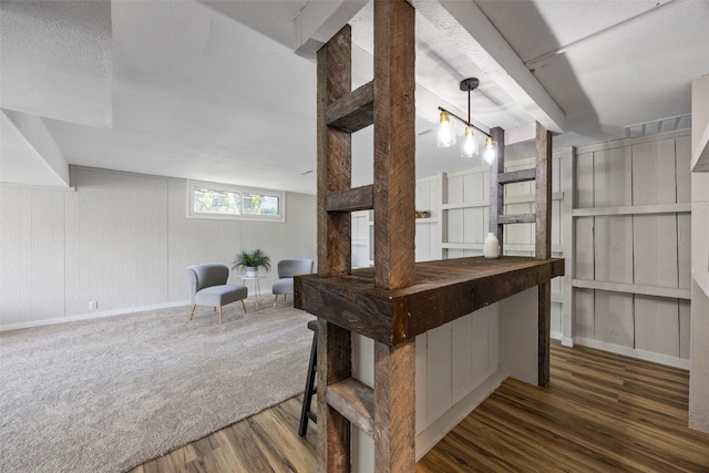 4812 Montclair Dr NW, Cedar Rapids, IA 52405 - bar featuring wood finished floors and baseboards