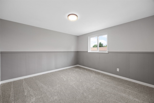4812 Montclair Dr NW, Cedar Rapids, IA 52405 - carpeted empty room with wainscoting