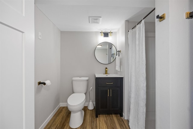 4812 Montclair Dr NW, Cedar Rapids, IA 52405 - bathroom featuring wood finished floors, vanity, and a shower with curtain