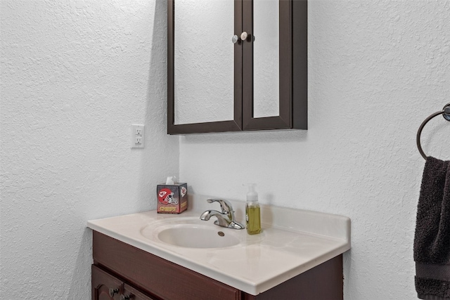 2816 Fruitland Blvd SW, Cedar Rapids, IA 52404 - bathroom featuring vanity and a textured wall