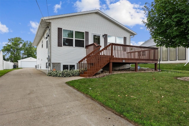 2816 Fruitland Blvd SW, Cedar Rapids, IA 52404 - view of front facade featuring a front lawn, an outbuilding, a deck, and a detached garage