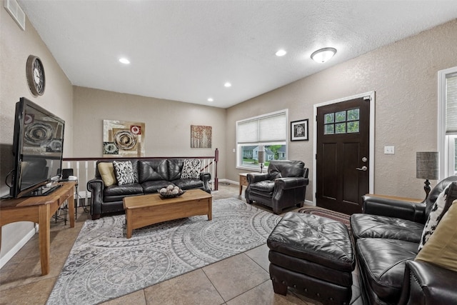2816 Fruitland Blvd SW, Cedar Rapids, IA 52404 - living room with a textured wall, recessed lighting, a textured ceiling, and tile patterned floors