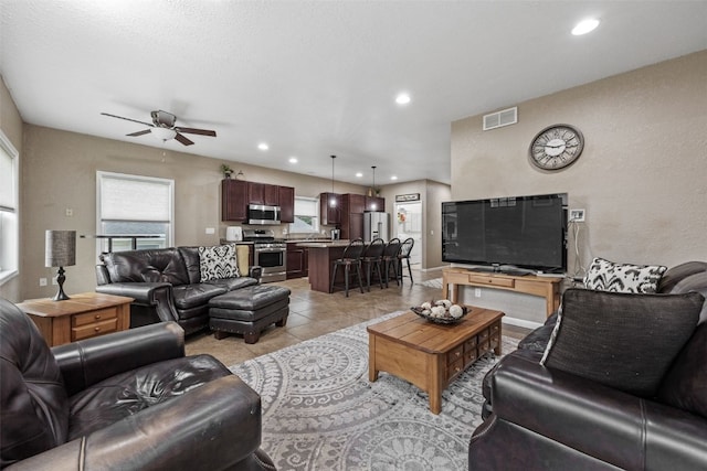 2816 Fruitland Blvd SW, Cedar Rapids, IA 52404 - living room featuring ceiling fan, recessed lighting, and light tile patterned floors