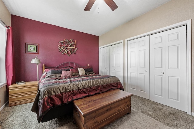 2816 Fruitland Blvd SW, Cedar Rapids, IA 52404 - carpeted bedroom featuring multiple closets and ceiling fan