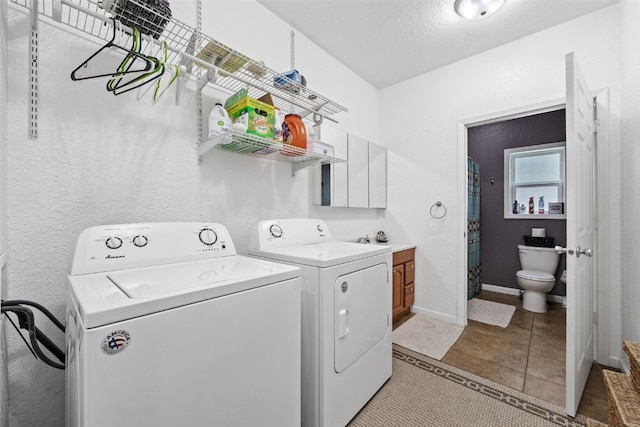 2816 Fruitland Blvd SW, Cedar Rapids, IA 52404 - washroom with independent washer and dryer and light tile patterned floors