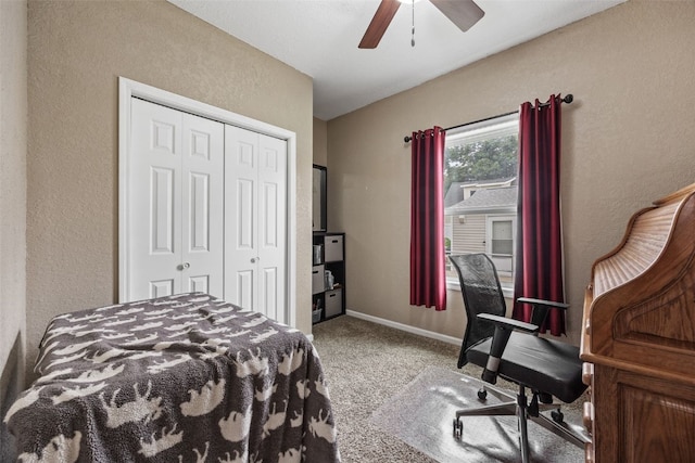 2816 Fruitland Blvd SW, Cedar Rapids, IA 52404 - bedroom with carpet floors, a closet, a textured wall, and a ceiling fan