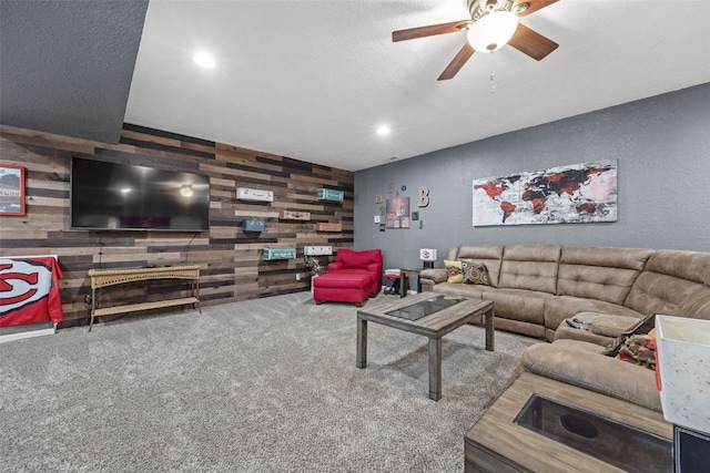 2816 Fruitland Blvd SW, Cedar Rapids, IA 52404 - carpeted living area with wooden walls, a ceiling fan, recessed lighting, and a textured wall