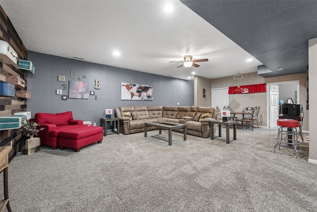2816 Fruitland Blvd SW, Cedar Rapids, IA 52404 - carpeted living area with ceiling fan, a textured ceiling, and recessed lighting