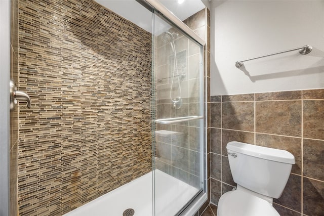1125 Saint Andrews Dr, North Liberty, IA 52317 - full bathroom with tile walls and a stall shower