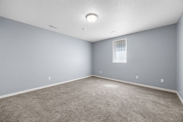 1125 Saint Andrews Dr, North Liberty, IA 52317 - empty room featuring a textured ceiling and carpet