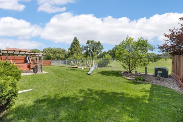1125 Saint Andrews Dr, North Liberty, IA 52317 - fenced backyard featuring a playground