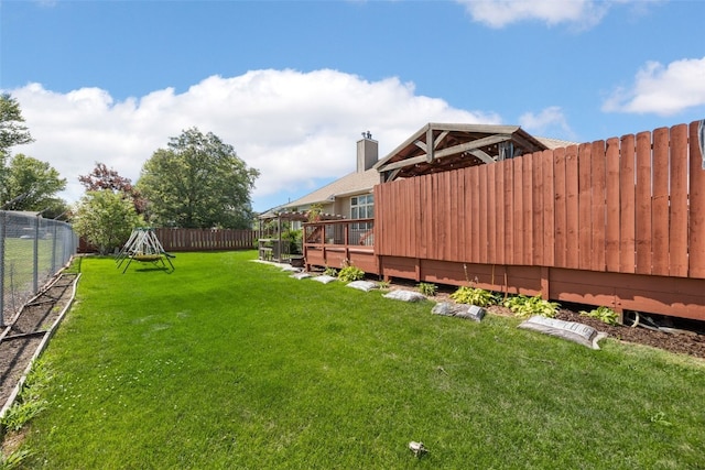 1125 Saint Andrews Dr, North Liberty, IA 52317 - fenced backyard with a wooden deck
