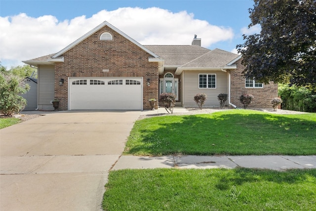 1125 Saint Andrews Dr, North Liberty, IA 52317 - view of front of home with a garage, a chimney, driveway, and a front lawn