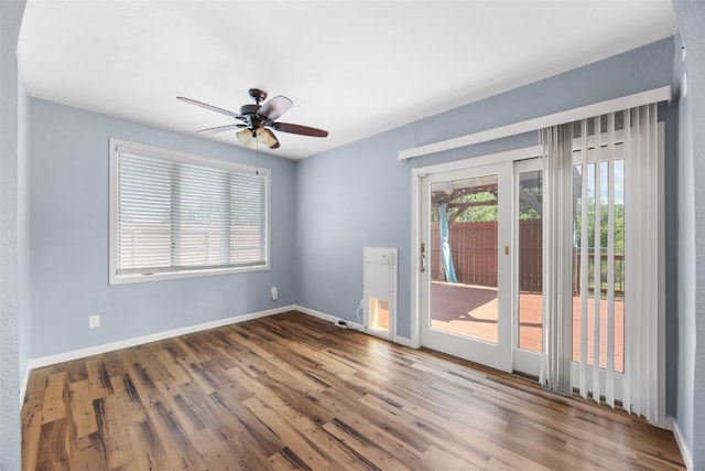 1125 Saint Andrews Dr, North Liberty, IA 52317 - spare room featuring wood finished floors and ceiling fan
