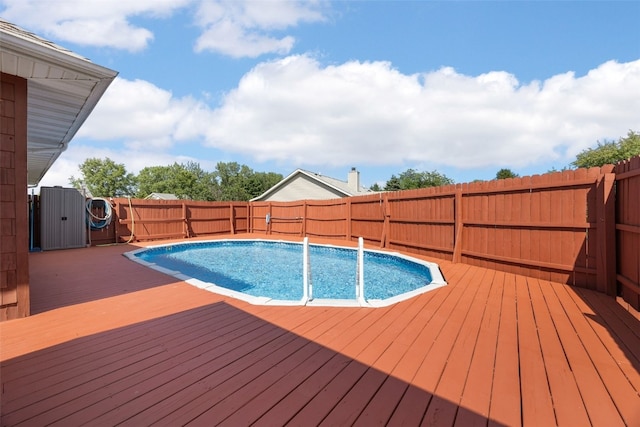 1125 Saint Andrews Dr, North Liberty, IA 52317 - view of pool featuring a wooden deck and a fenced backyard