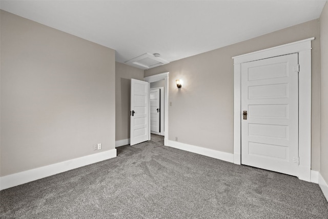 214 15th St NW, Cedar Rapids, IA 52405 - unfurnished bedroom featuring carpet floors and attic access