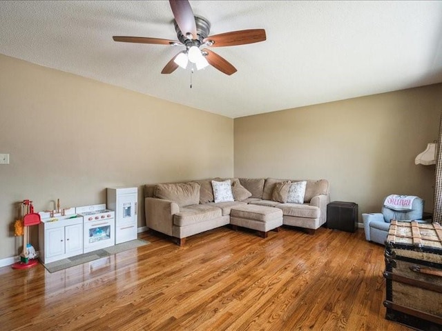 1175 F Ave, Marion, IA 52302 - living area featuring wood finished floors and ceiling fan