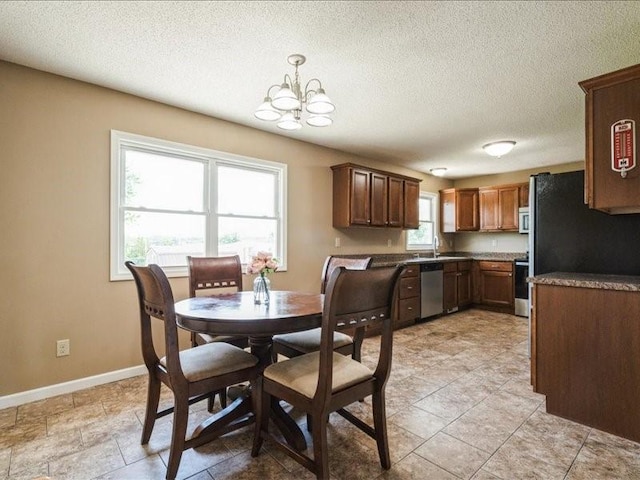 1175 F Ave, Marion, IA 52302 - dining area with a chandelier and a textured ceiling