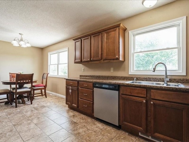 1175 F Ave, Marion, IA 52302 - kitchen with stainless steel dishwasher, dark countertops, a chandelier, and a textured ceiling