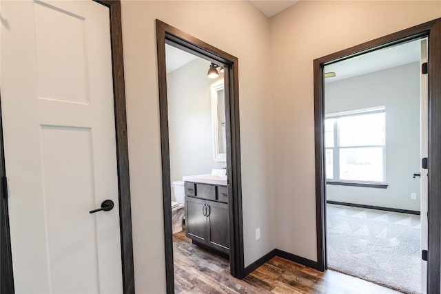 1600 Heartland St, Fairfax, IA 52228 - corridor featuring wood finished floors and baseboards