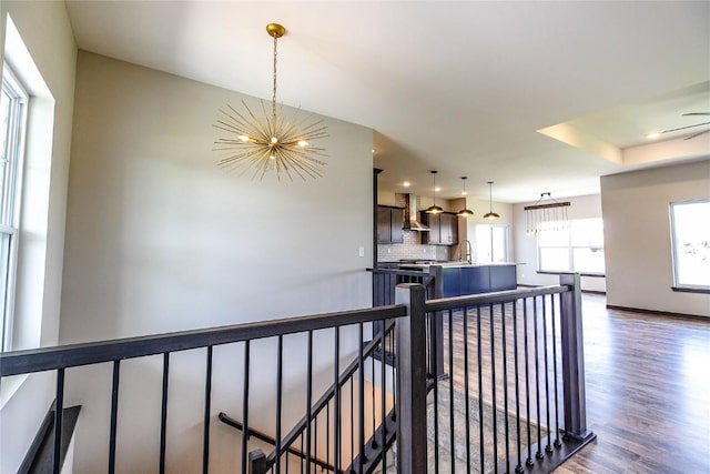 1600 Heartland St, Fairfax, IA 52228 - hallway with a chandelier, an upstairs landing, dark wood-style flooring, and recessed lighting