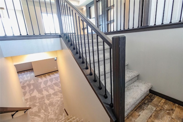 1600 Heartland St, Fairfax, IA 52228 - staircase with wood finished floors and baseboards