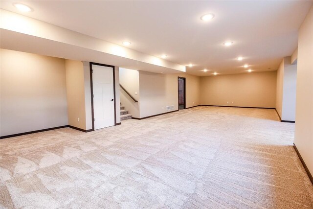 1600 Heartland St, Fairfax, IA 52228 - finished below grade area with light colored carpet, recessed lighting, and stairs